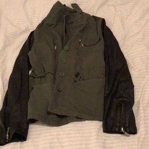 A olive green jacket that is military style.
